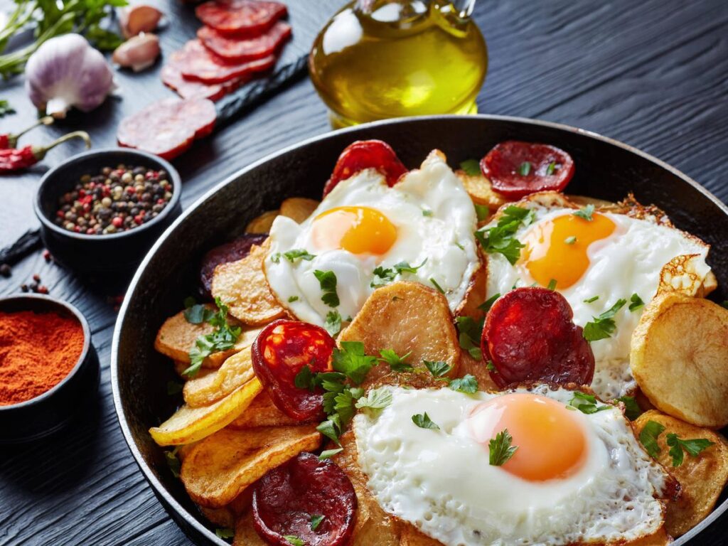 Indulge in a Spanish classic with our easy recipe for Huevos Rotos con Patatas